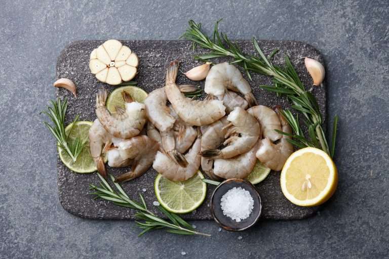 King Prawns on a slate board with limes & rosemary