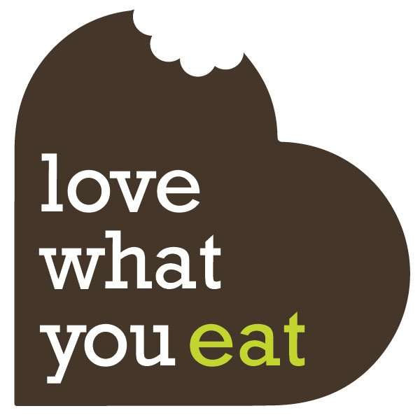 Love What Eat in type overlaid on a heart with a bite taken out